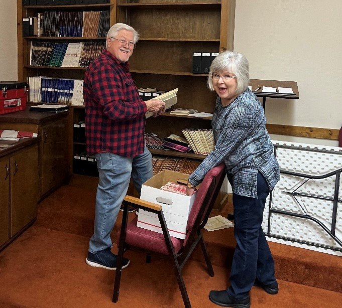 Jim and Donna Brinkley collect items for the Conasauga Baptist Association's new music library.