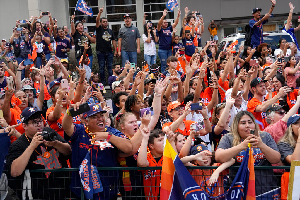 Fans cheer during a victory parade for the World Series champion Houston Astros, Monday, Nov. 7, 2022, in Houston. (AP Photo/David J. Phillip)