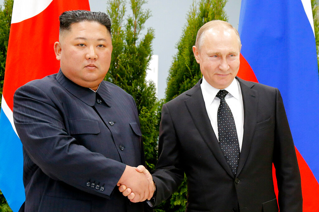 Russian President Vladimir Putin, right, and North Korea's leader Kim Jong Un shake hands during their meeting in Vladivostok, Russia on April 25, 2019. (AP Photo/Alexander Zemlianichenko, Pool, File)