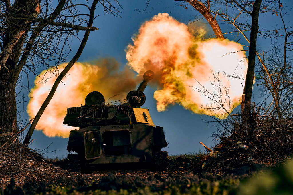 A self-propelled artillery vehicle fires near Bakhmut, Donetsk region, Ukraine, Wednesday, Nov. 9, 2022. (AP Photo/LIBKOS)