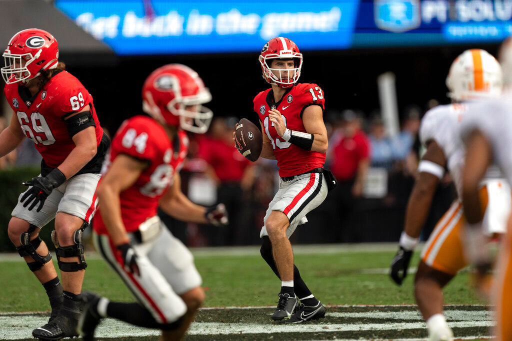 Georgia quarterback Stetson Bennett (13) throws from the pocket during the first half against Tennessee, Saturday, Nov. 5, 2022, in Athens, Ga. (AP Photo/John Bazemore)