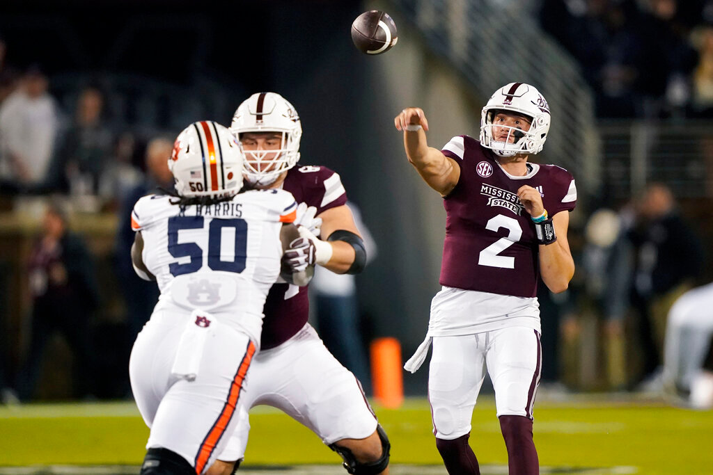 Mississippi State quarterback Will Rogers (2) throws a pass over Auburn defensive lineman Marcus Harris (50) during the second half in Starkville, Miss., Saturday, Nov. 5, 2022. Mississippi State won 39-33. (AP Photo/Rogelio V. Solis)