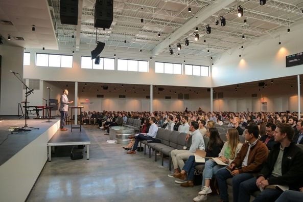 Pastor Jason Dees preaches to a full house in one of three services on the occasion of the grand opening of the new worship center at Christ Covenant.