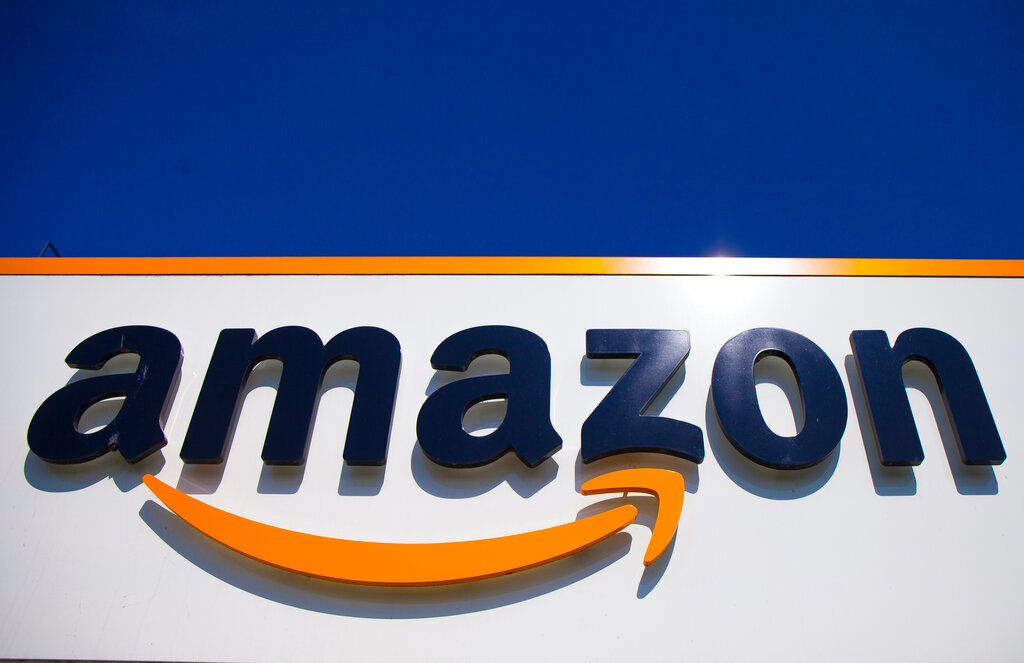 FILE - The Amazon logo is seen in Douai, northern France, Thursday, April 16, 2020. On Thursday, Nov. 17, 2022, Amazon CEO Andy Jassy said the mass layoffs that began at the company this week will continue into the following year. (AP Photo/Michel Spingler, File)