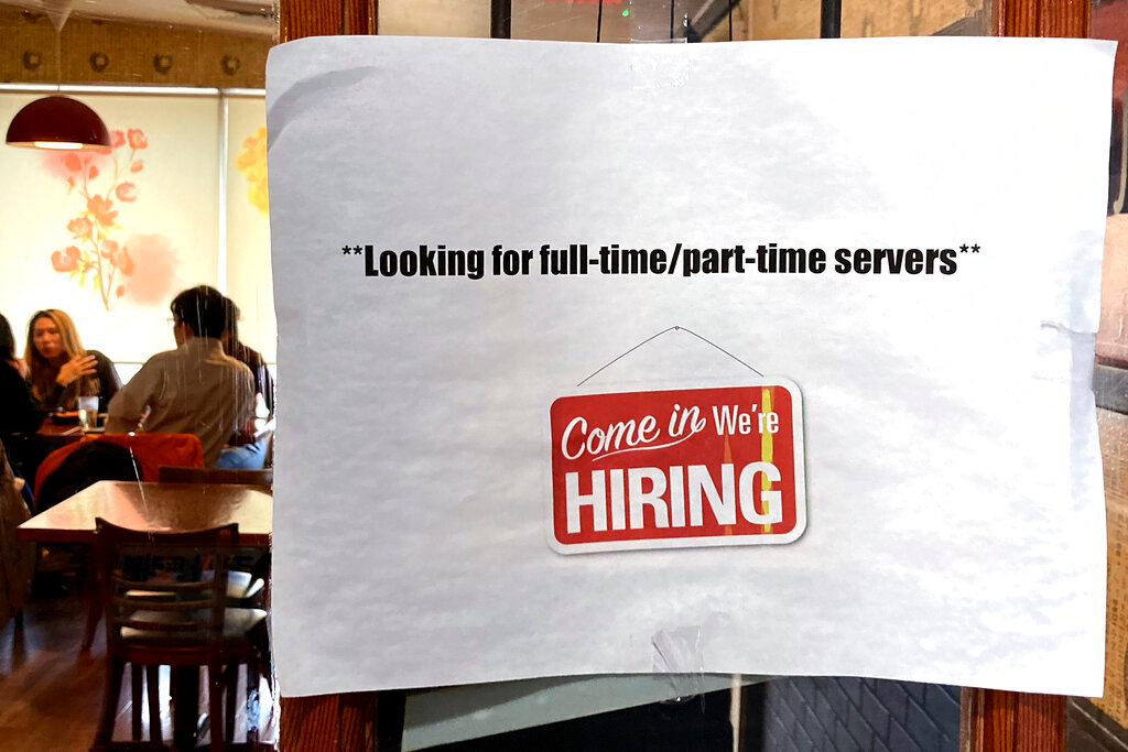 FILE - A hiring sign is displayed at a restaurant in Morton Grove, Ill., Thursday, April 28, 2022.  Labor Department releases weekly report on unemployment benefits on Wednesday, Nov. 23.  (AP Photo/Nam Y. Huh, File)