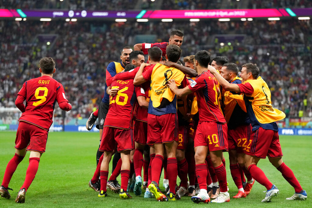 Spanish players celebrate after Alvaro Morata scored the opening goal during their World Cup group E soccer match against Germany at the Al Bayt Stadium in Al Khor, Qatar, Sunday, Nov. 27, 2022. (AP Photo/Matthias Schrader)