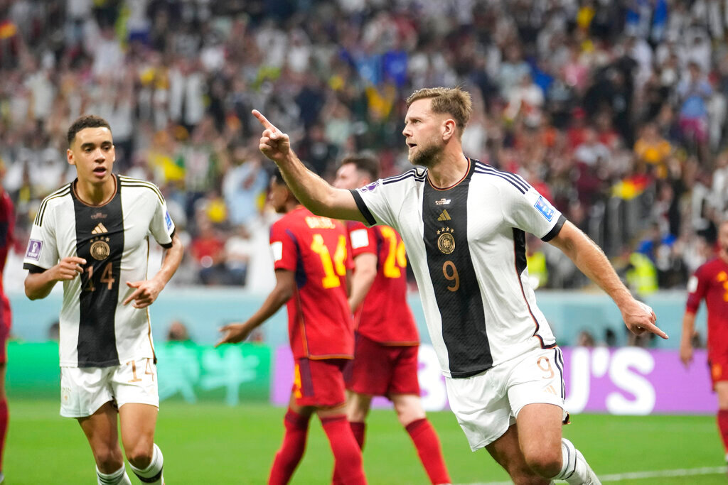 Germany's Niclas Fuellkrug celebrates after he scored his side's first goal during their World Cup group E soccer match against Spain at the Al Bayt Stadium in Al Khor, Qatar, Sunday, Nov. 27, 2022. (AP Photo/Luca Bruno)