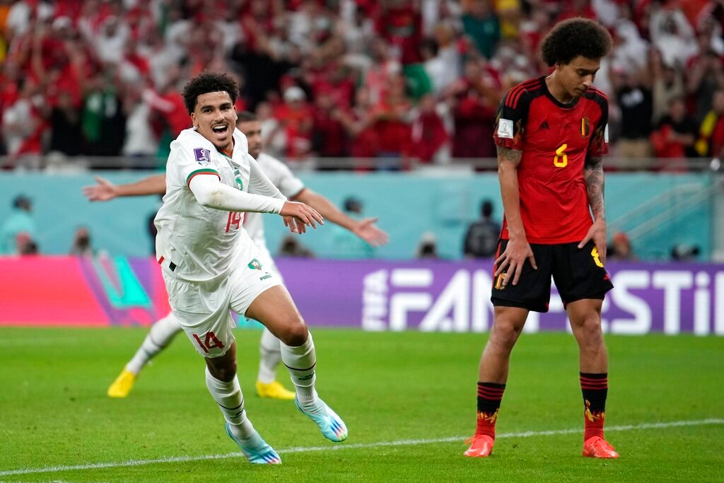 Morocco's Zakaria Aboukhlal celebrates his side's second goal besides Belgium's Axel Witsel during their World Cup group F soccer match at the Al Thumama Stadium in Doha, Qatar, Sunday, Nov. 27, 2022. (AP Photo/Christophe Ena)