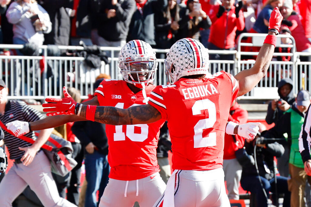 Ohio State receiver Marvin Harrison, left, celebrates his touchdown against Michigan with teammate Emeka Egbuka during the first half Saturday, Nov. 26, 2022, in Columbus, Ohio. (AP Photo/Jay LaPrete)