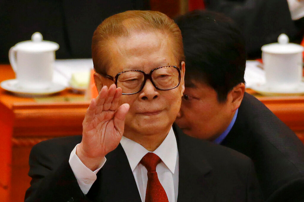 Former Chinese President Jiang Zemin gestures during the opening session of the 18th Communist Party Congress held at the Great Hall of the People in Beijing, China, Thursday, Nov. 8, 2012. (AP Photo/Ng Han Guan, File)