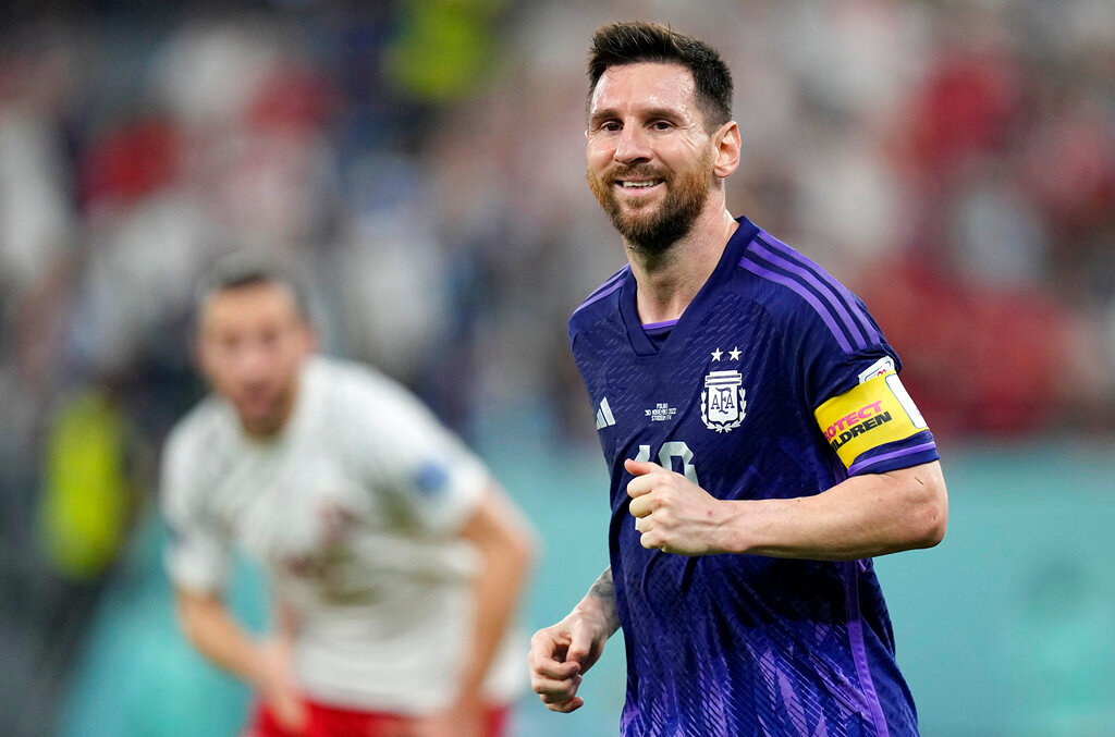 Argentina's Lionel Messi smiles during a World Cup group C match against Poland in Doha, Qatar, Wednesday, Nov. 30, 2022. (AP Photo/Ariel Schalit)