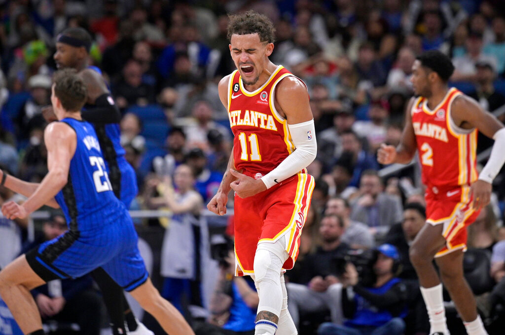 Atlanta Hawks guard Trae Young (11) reacts after a score during the second half against the Orlando Magic, Wednesday, Nov. 30, 2022, in Orlando, Fla. (AP Photo/Phelan M. Ebenhack)