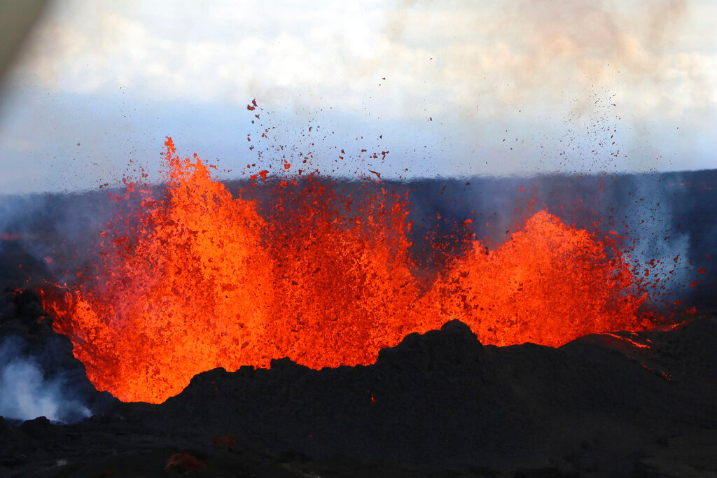 Lava flows on Mauna Loa, the world's largest active volcano, on Wednesday, Nov. 30, 2022, near Hilo, Hawaii. (Hawaii Dept. of Land and Natural Resources via AP)