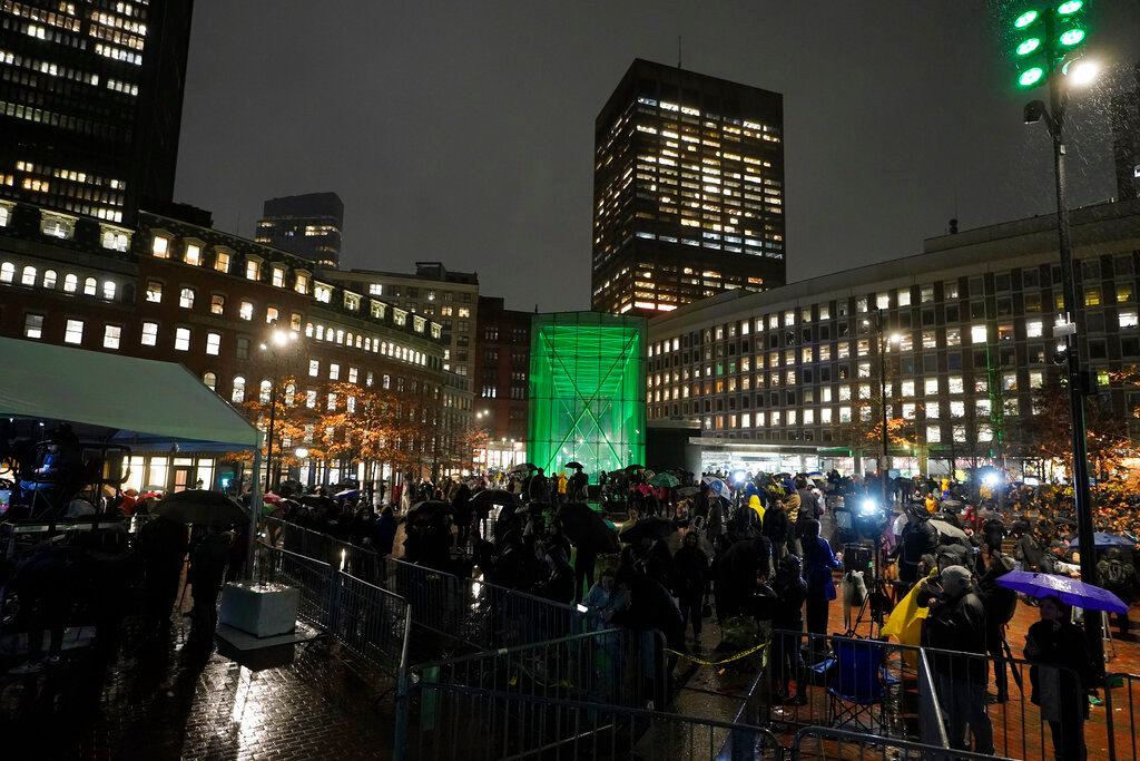 A Boston MBTA subway station is illuminated with green light following a ceremony attended by Britain's Prince William and Kate, Princess of Wales, Wednesday, Nov. 30, 2022, in Boston. (AP Photo/Steven Senne)