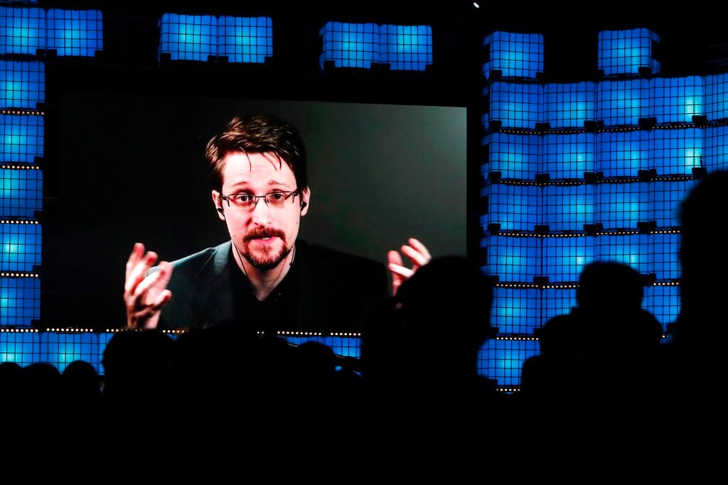 Former U.S. National Security Agency contractor Edward Snowden addresses attendees through video link at the Web Summit technology conference in Lisbon on Nov. 4, 2019. (AP Photo/Armando Franca, File)
