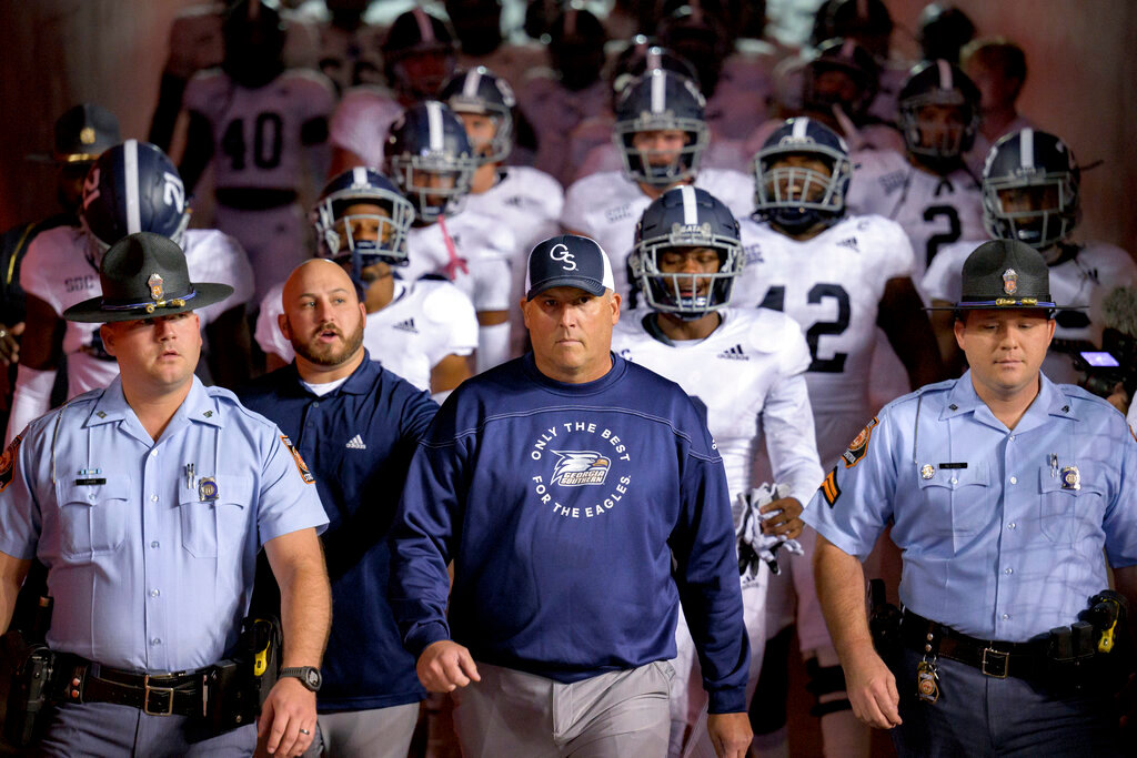 Georgia Southern head coach Clay Helton enters the field with his team before an NCAA football game against Louisiana Lafayette on Nov. 10, 2022, in Lafayette, La. Georgia Southern and Buffalo will play in the Camellia Bowl on Dec. 27, 2022. (AP Photo/Matthew Hinton, File)