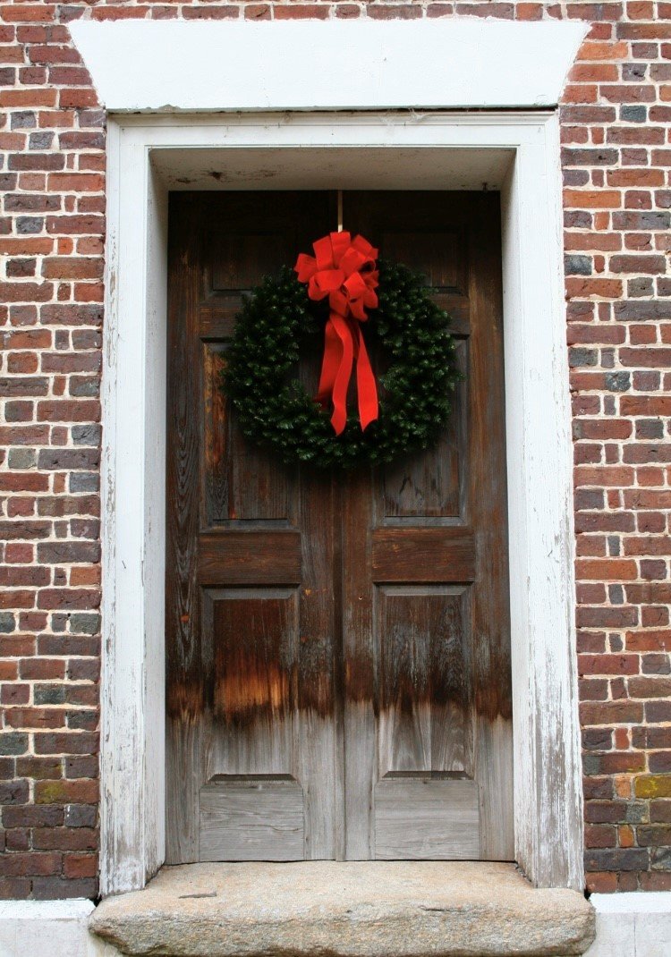 Members of the congregation at Kiokee Baptist Church celebrate their rich history by placing a wreath on their old sanctuary dating back to 1808.