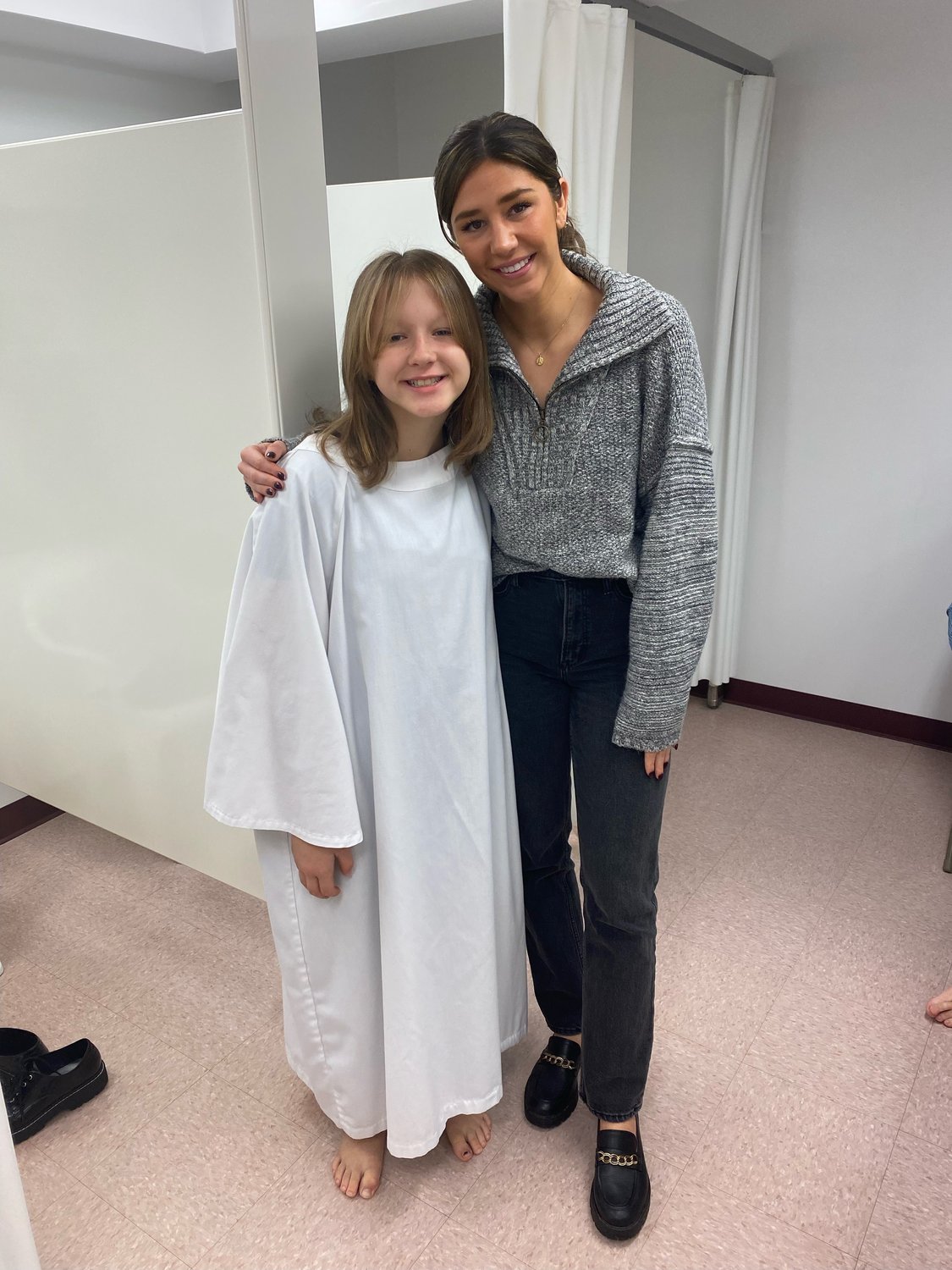 Lilly Chitwood, left, poses with her big sister, Anna. Lilly is the youngest and last of the Chitwood children to be baptized.