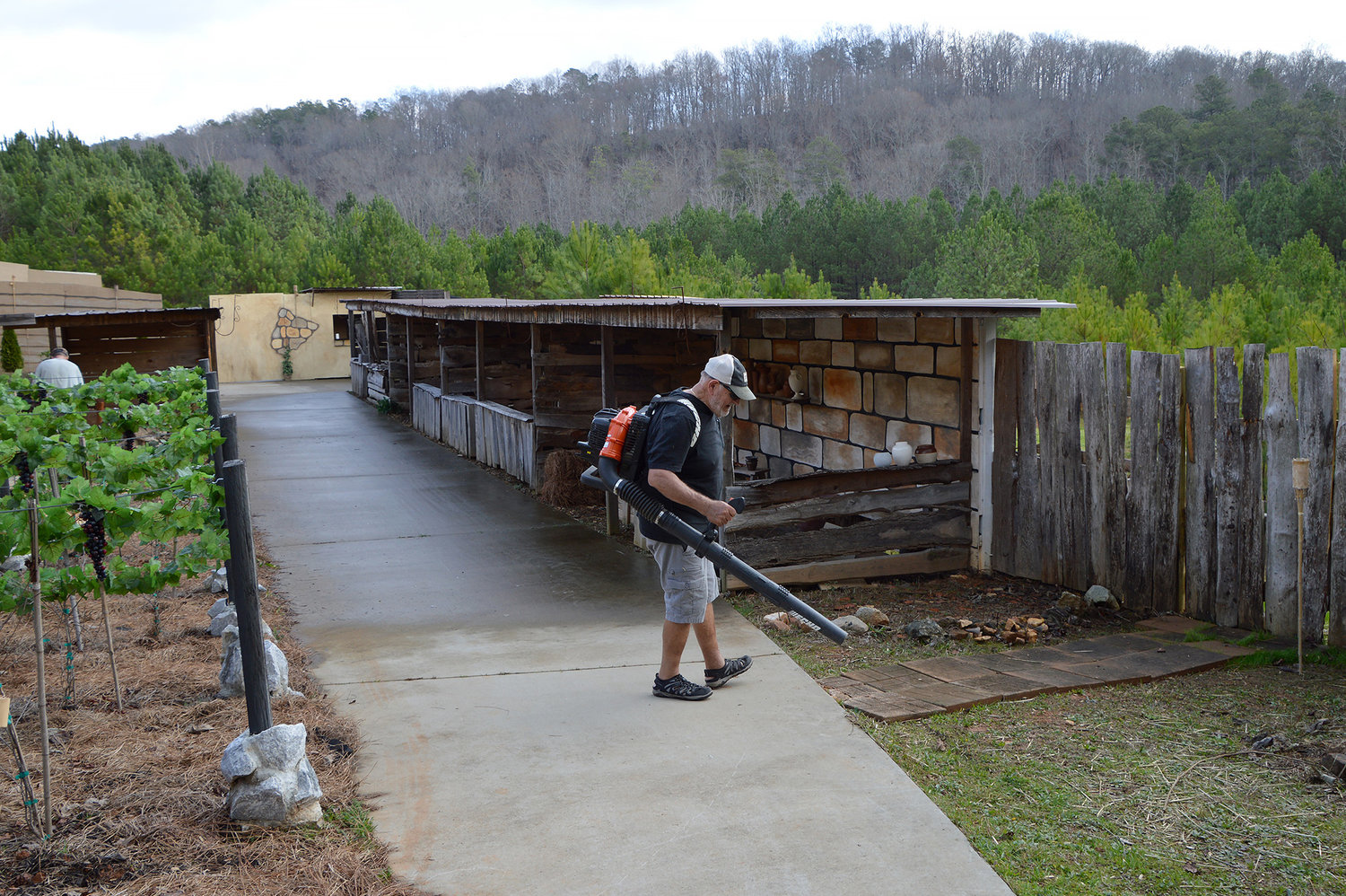 Jim Yearwood blows leaves from the Bethlehem village set on the grounds of Legacy Baptist Church in Dallas, Ga., Thursday, Dec. 8, 2022, as final preparations are made for the Legacy of Bethlehem production. (Index/Henry Durand)
