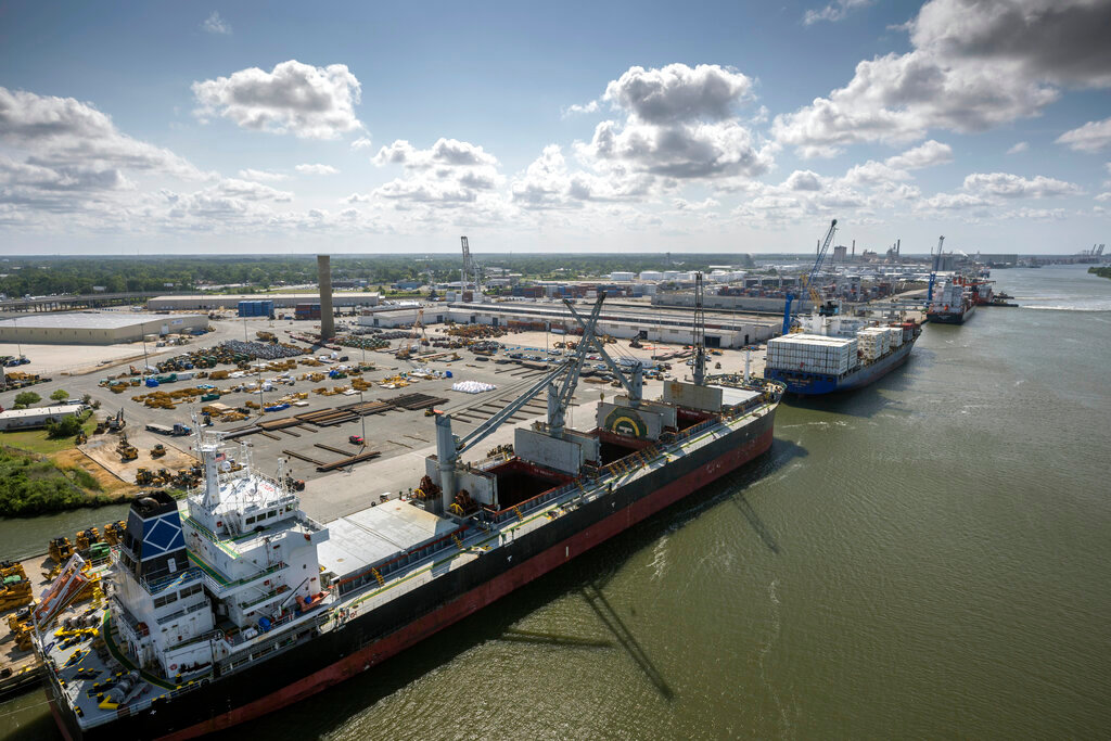Cargo is loaded and unloaded from three vessels at the Georgia Ports Authority Ocean Terminal, June 24, 2022 in Savannah, Ga. (Stephen B. Morton/Georgia Port Authority via AP)