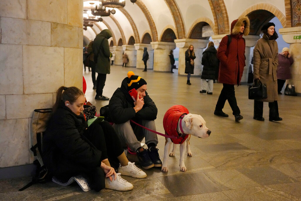 People rest in a subway station being used as a bomb shelter during a rocket attack in Kyiv, Ukraine, Thursday, Dec. 29, 2022. (AP Photo/Efrem Lukatsky)