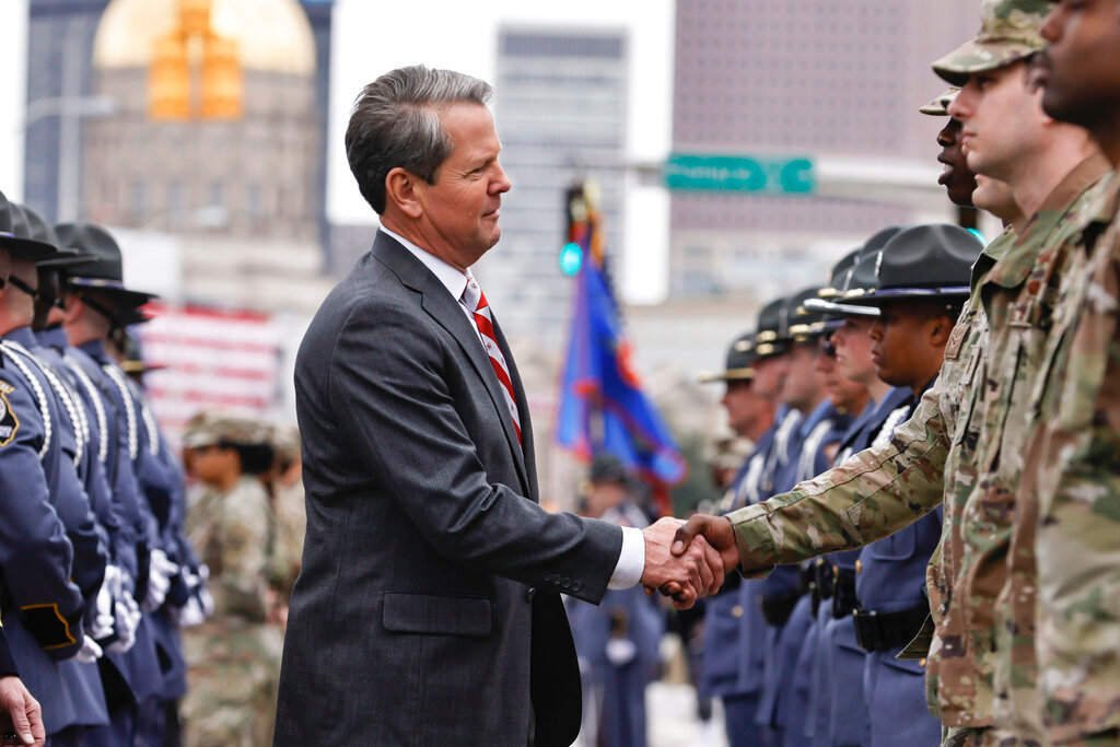 Georgia Gov. Brian Kemp shakes hands with a soldier following his inauguration at Georgia State Convocation Center in Atlanta on Thursday, Jan. 12, 2023. (Natrice Miller/Atlanta Journal-Constitution via AP)