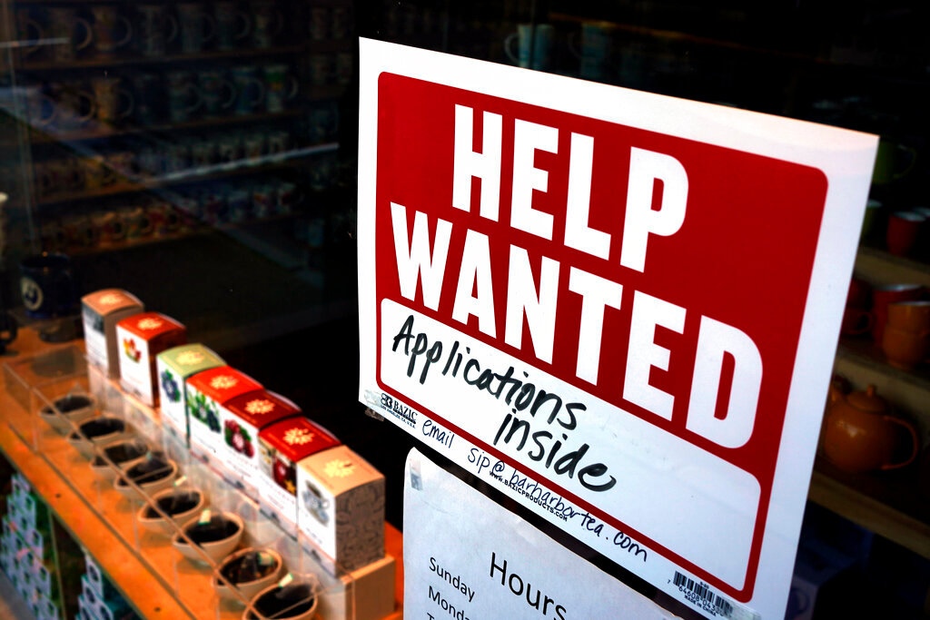 A help-wanted sign hangs in the front window of the Bar Harbor Tea Room, June 11, 2022, in Bar Harbor, Maine. (AP Photo/Robert F. Bukaty, File)