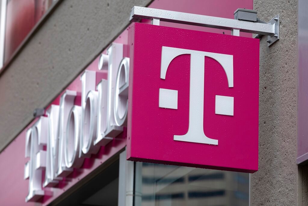 The T-Mobile logo is seen on a storefront in Boston. T-Mobile said Thursday, Jan. 19, 2023, that an unidentified malicious intruder breached its network in late November and stole data on 37 million customers. (AP Photo/Michael Dwyer, File)