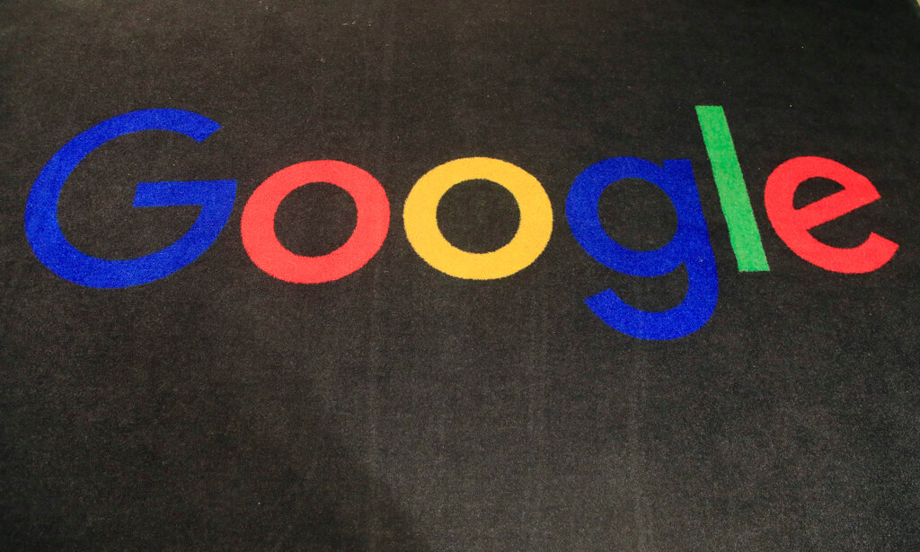 The logo of Google is displayed on a carpet at the entrance hall of Google France in Paris, on Nov. 18, 2019. (AP Photo/Michel Euler, File)