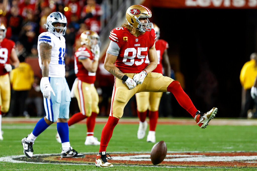 San Francisco 49ers tight end George Kittle (85) celebrates after catching a pass against the Dallas Cowboys during the second half of an NFL divisional round playoff game in Santa Clara, Calif., Sunday, Jan. 22, 2023. (AP Photo/Josie Lepe)