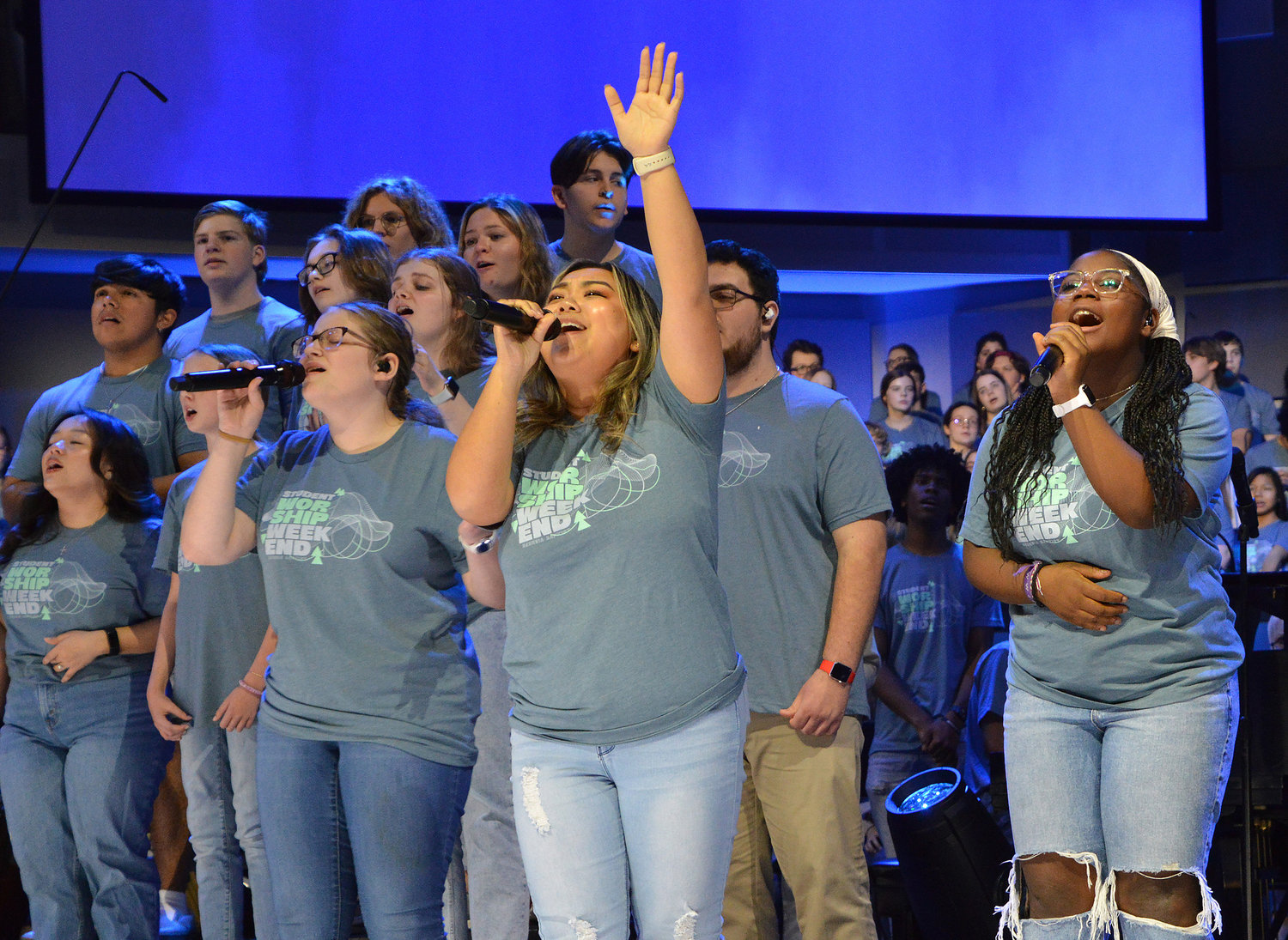 Hadley Sansom, center left, Kristy Xiong and Lily Allred, right, sing during a worship concert at the conclusion of REEL Fest 2023 held at First Baptist Church of Jonesboro, Ga., Saturday, Jan. 21, 2023. (Index/Henry Durand)