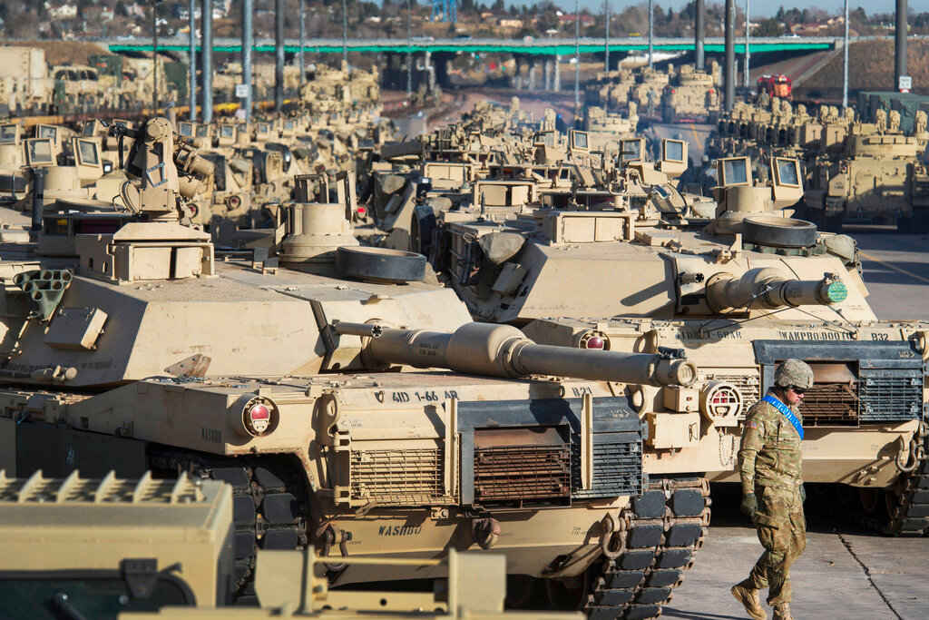 A soldier walks past a line of M1 Abrams tanks, Nov. 29, 2016, at Fort Carson in Colorado Springs, Colo.  In what would be a reversal, the Biden administration is poised to approve sending M1 Abrams tanks to Ukraine, U.S. officials said Tuesday, as international reluctance toward sending tanks to the battlefront against the Russians begins to erode. The decision could be announced as soon as Wednesday though it could take months or years for the tanks to be delivered.  (Christian Murdock/The Gazette via AP, File)