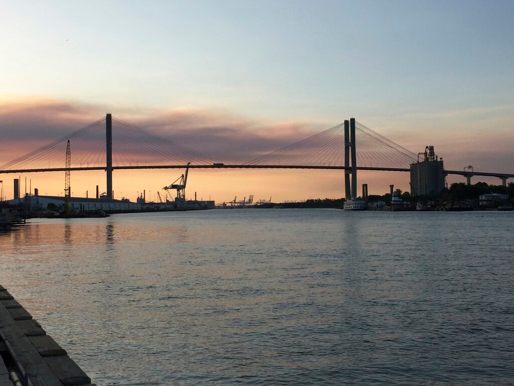 The Eugene Talmadge Memorial Bridge is pictured at sunset in Savannah, Ga., April 20, 2017. Georgia officials have signed off on a plan to raise Savannah's towering suspension bridge to make room for larger cargo ships calling on the city's busy seaport. (AP Photo/Sally Hale, File)