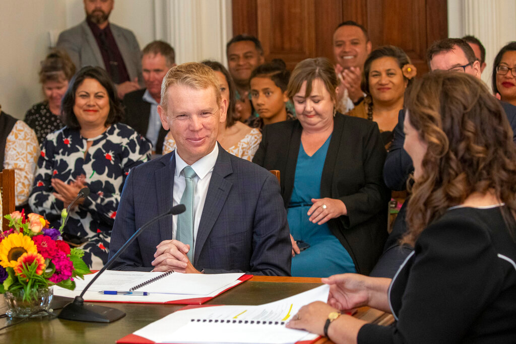 Chris Hipkins is sworn in as New Zealand's next prime minister by Governor-General Dame Cindy Kiro, right, at Government House in Wellington, Wednesday, Jan. 25, 2023. (Mark Mitchell/New Zealand Herald via AP)