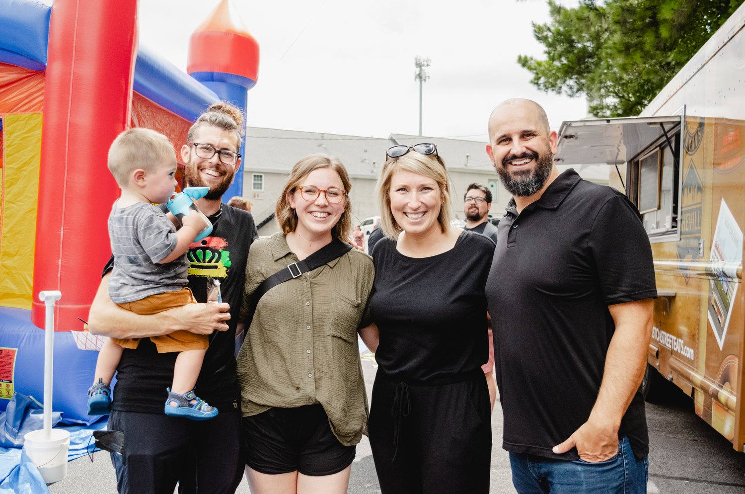 Brandon and Kristen Nichols with Andrew and Kimberly Bradford, and their son Isaac, at a community outreach event. (Photo/Mercy Hill Church)
