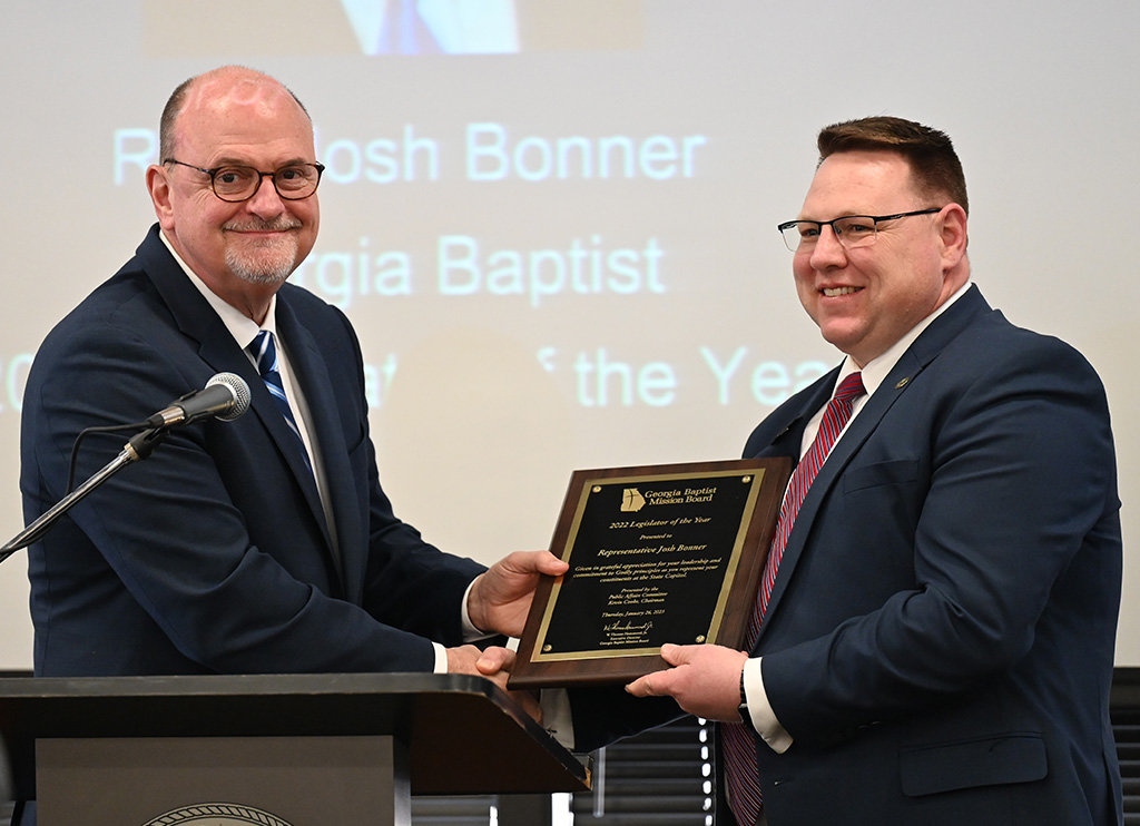 Georgia Baptist Mission Board Executive Director W. Thomas Hammond, left, presents state Rep. Josh Bonner with the 2022 Legislator of the Year Award during a presentation at the Capitol in Atlanta, Thursday, Jan. 26, 2023. (Index/Henry Durand)