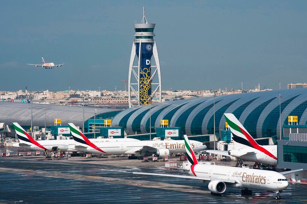 An Emirates jetliner comes in for landing at the Dubai International Airport in Dubai, United Arab Emirates, Dec. 11, 2019. (AP Photo/Jon Gambrell, File)