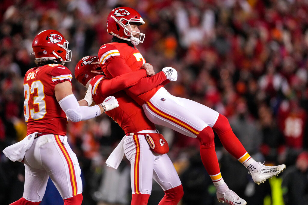 Kansas City Chiefs placekicker Harrison Butker (7) is lifted in the air after his game-winning field goal against the Cincinnati Bengals during the second half of the AFC Championship game, Sunday, Jan. 29, 2023, in Kansas City, Mo. The Chiefs won 23-20. (AP Photo/Jeff Roberson)