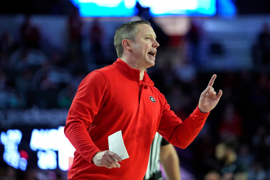 Georgia head coach Mike White yells to his players on the court during the first half of an NCAA college basketball game against Auburn, Jan. 4, 2023, in Athens, Ga. (AP Photo/John Bazemore)