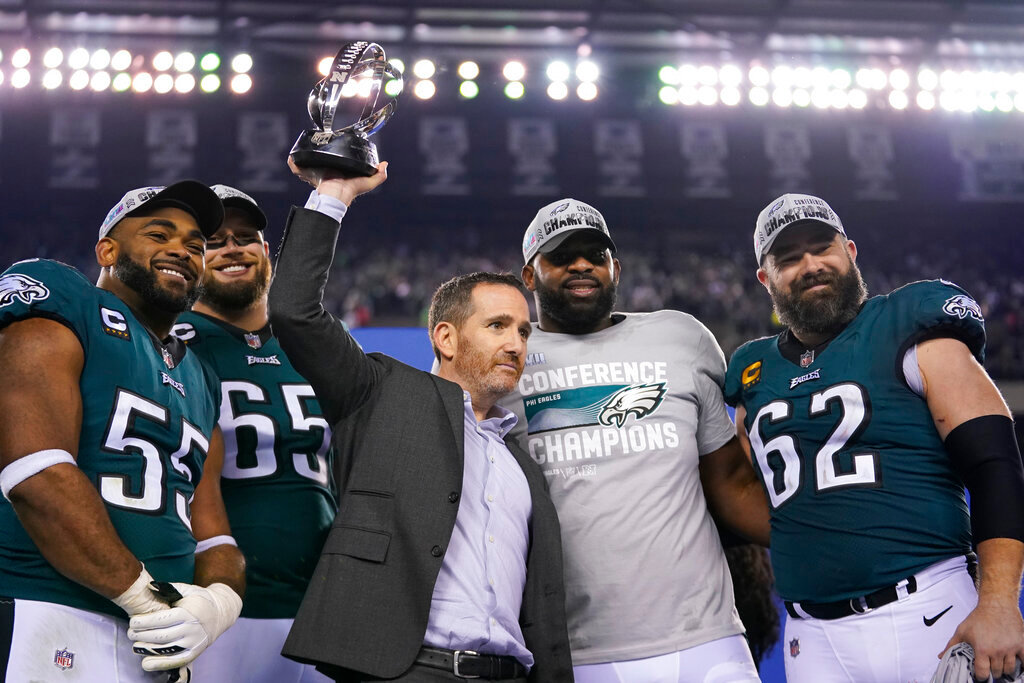 Philadelphia Eagles general manager Howie Roseman, center, stands with defensive end Brandon Graham (55) offensive tackle Lane Johnson (65), defensive tackle Fletcher Cox, and center Jason Kelce (62) after their NFC Championship game victory over the San Francisco 49ers on Sunday, Jan. 29, 2023, in Philadelphia. The Eagles won 31-7. (AP Photo/Matt Slocum)