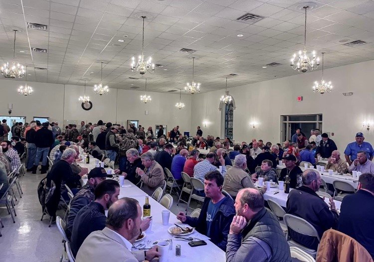 People packed around tables at First Baptist Church in Blackshear for a venison supper. The church's men hunted, cooked and served the venison.