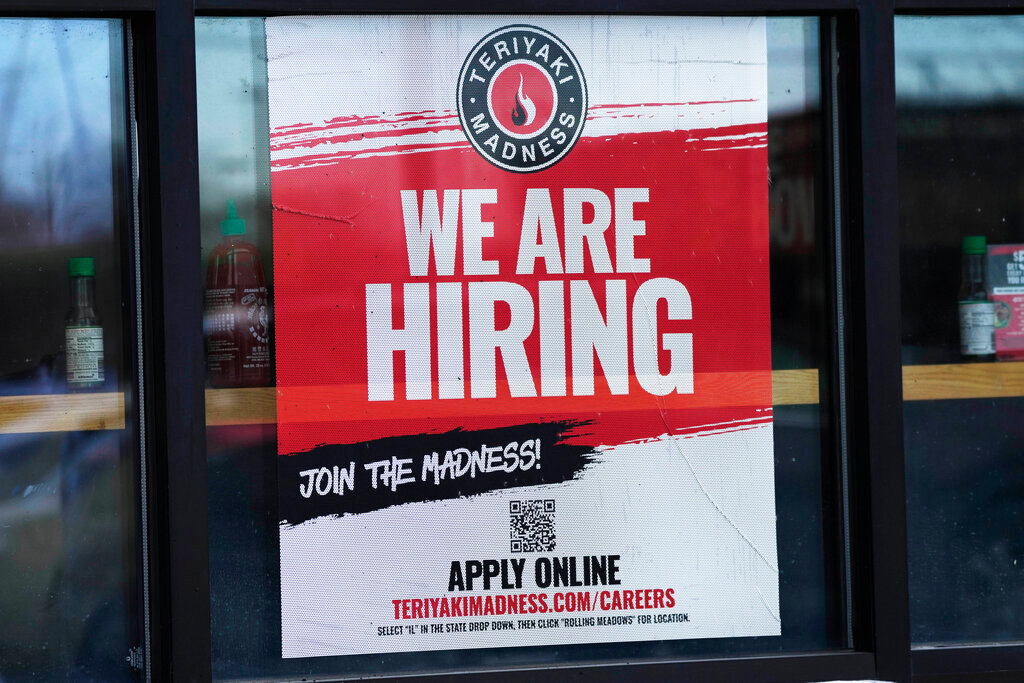 A hiring sign is displayed at a restaurant in Rolling Meadows, Ill. (AP Photo/Nam Y. Huh)