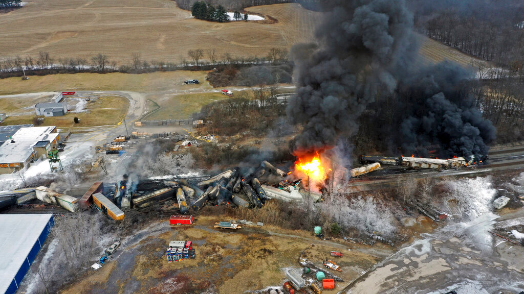 Portions of a Norfolk and Southern freight train that derailed Friday night in East Palestine, Ohio, continue to burn Saturday, Feb. 4, 2023. (AP Photo/Gene J. Puskar)