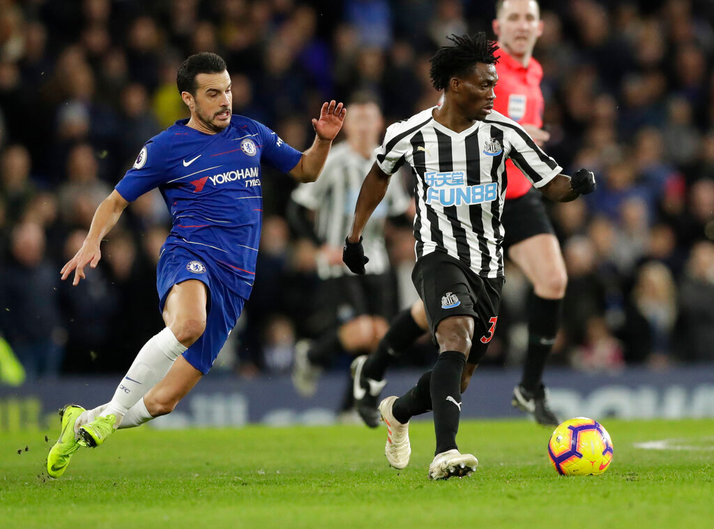 Chelsea's Pedro, left, and Newcastle United's Christian Atsu vie for the ball during an English Premier League soccer match in London, Jan. 12, 2019. Atsu is missing and believed to be trapped under rubble following the powerful earthquake that struck Turkey on Monday. (AP Photo/Matt Dunham, File)