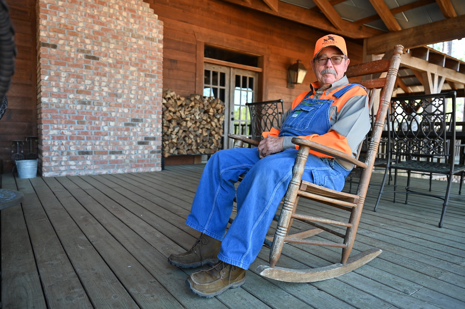 Gary Thrash, a retired homebuilder, poses for a photo on the porch of the lodge at Millennia Farms in Sumner, Ga., on Monday, February 6, 2023. (Index/Roger Alford)