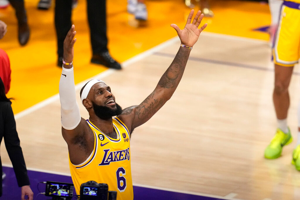 Los Angeles Lakers forward LeBron James celebrates after scoring to pass Kareem Abdul-Jabbar to become the NBA's all-time leading scorer during the second half against the Oklahoma City Thunder Tuesday, Feb. 7, 2023, in Los Angeles. (AP Photo/Marcio Jose Sanchez)