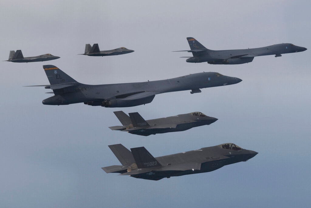 U.S. Air Force B-1B bombers, center, F-22 fighter jets and South Korean Air Force F-35 fighter jets, bottom, fly over South Korea Peninsula during a joint drill in South Korea, on Jan. 1, 2023. (South Korean Defense Ministry via AP, File)