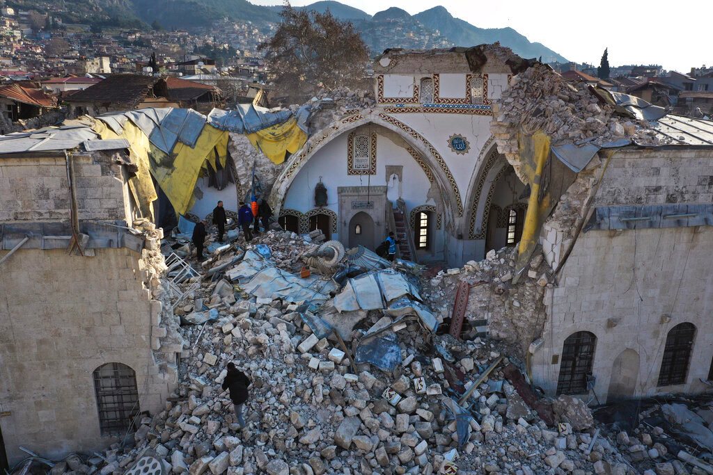 Turkish citizens check the historic Habib Najjar mosque which was destroyed by a devastating earthquake, in the old city of Antakya, Turkey, Saturday, Feb. 11, 2023. (AP Photo/Hussein Malla)