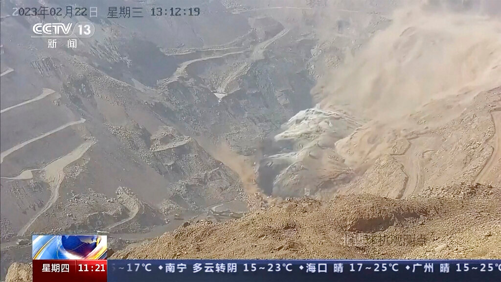Dirt moves down the side of a hill at an open pit mine in Alxa League in northern China's Inner Mongolia Autonomous Region, Wednesday, Feb. 22, 2023. (CCTV via AP)