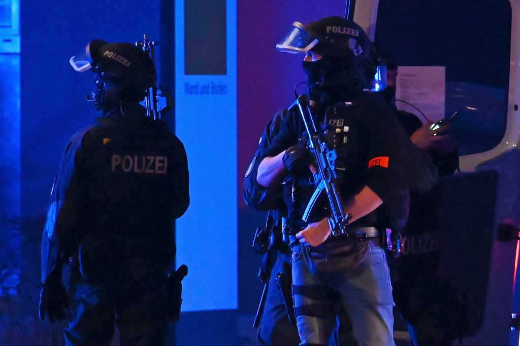 Police officers near the scene of a shooting in Hamburg, German, Thursday, March 9, 2023. (Jonas Walzberg/dpa via AP)